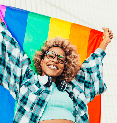 Equality-Inclusion-2 Woman holding Pride Flag